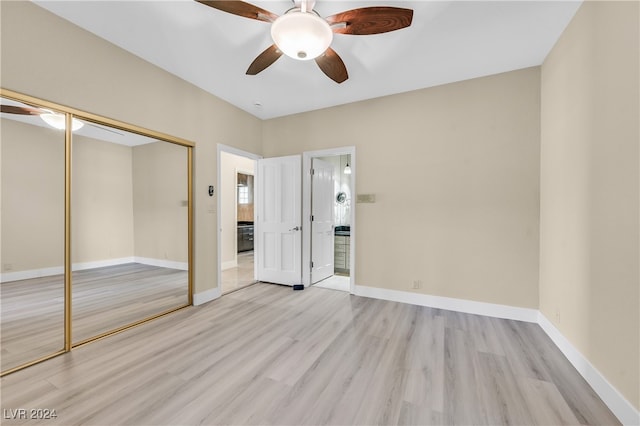 unfurnished bedroom with ceiling fan, light hardwood / wood-style flooring, and a closet