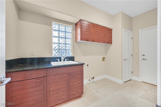 interior space featuring light tile patterned flooring and sink