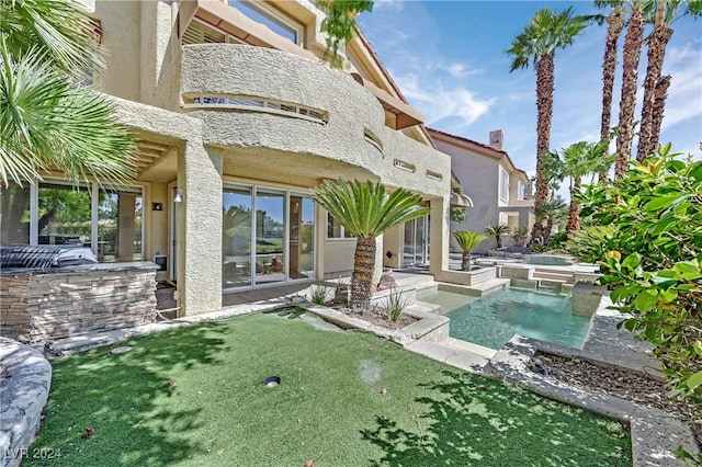 view of yard featuring a balcony and a patio area