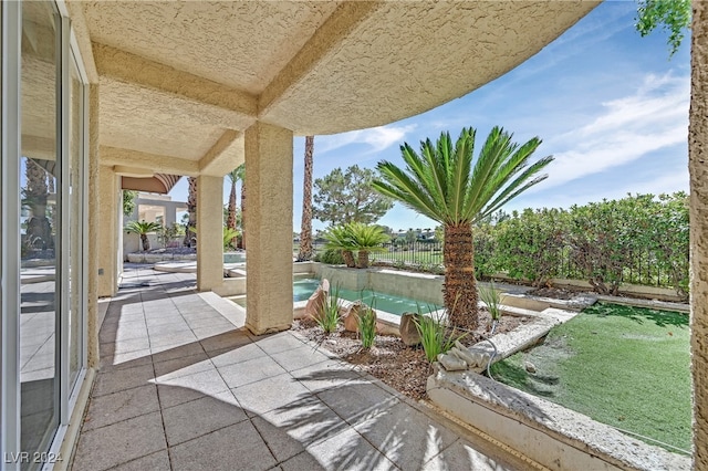 view of patio / terrace featuring a fenced in pool