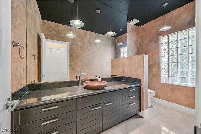 bathroom with tile patterned floors, vanity, and toilet