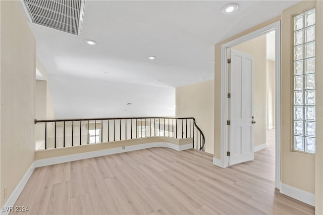 spare room featuring light hardwood / wood-style floors