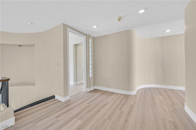 unfurnished room with light hardwood / wood-style floors