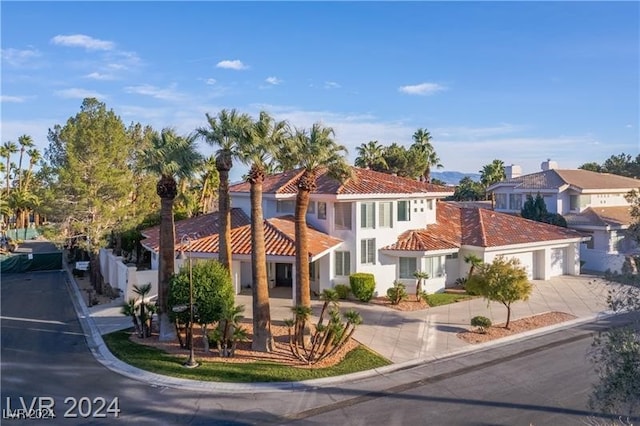 mediterranean / spanish house with a garage