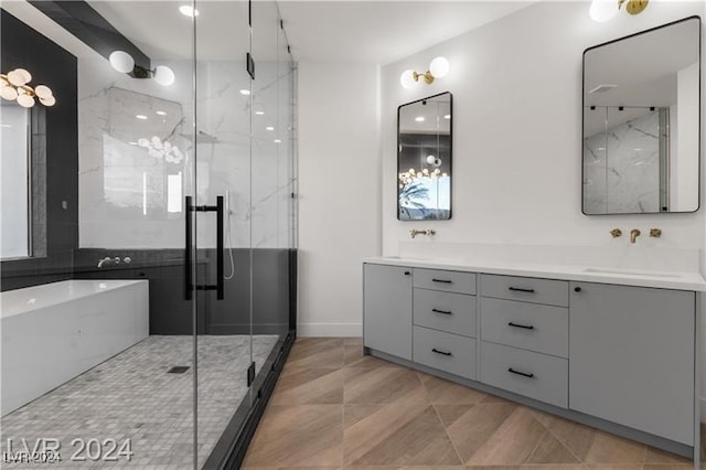 bathroom with shower with separate bathtub, tile patterned floors, and vanity