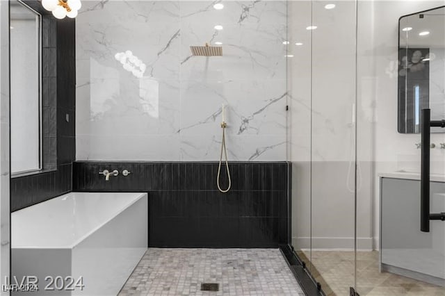 bathroom featuring vanity and an enclosed shower