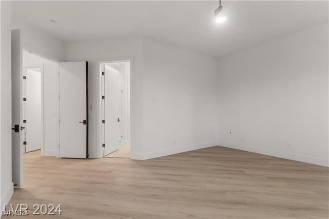 unfurnished room featuring light hardwood / wood-style flooring