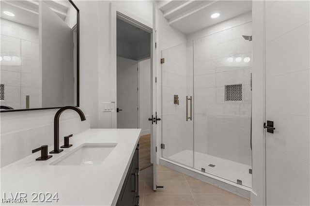 bathroom featuring vanity, tile patterned flooring, and an enclosed shower