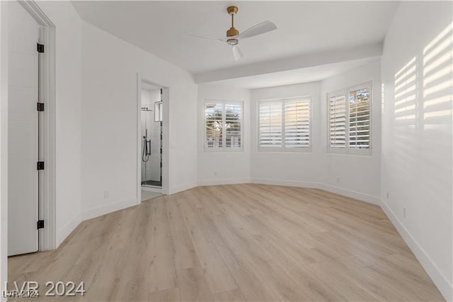 unfurnished room with light hardwood / wood-style floors, ceiling fan, and plenty of natural light