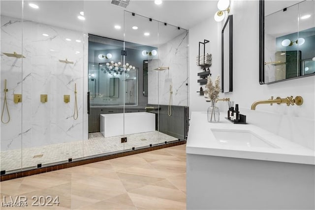 bathroom with walk in shower and vanity