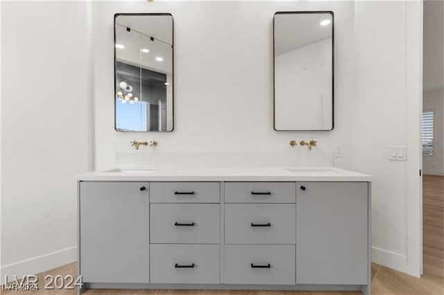 bathroom with vanity and hardwood / wood-style floors