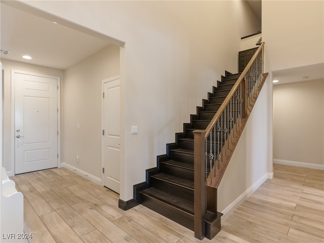 stairway featuring hardwood / wood-style floors