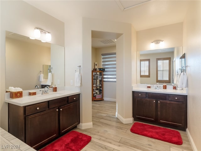 bathroom featuring vanity and wood-type flooring