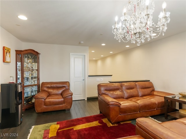 living room featuring a chandelier and dark hardwood / wood-style floors