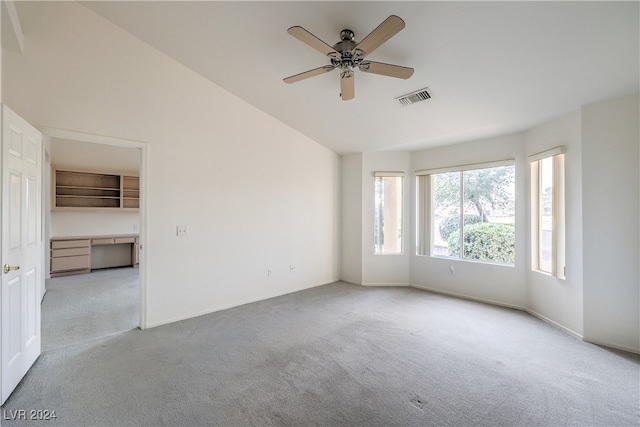 spare room featuring light carpet and ceiling fan