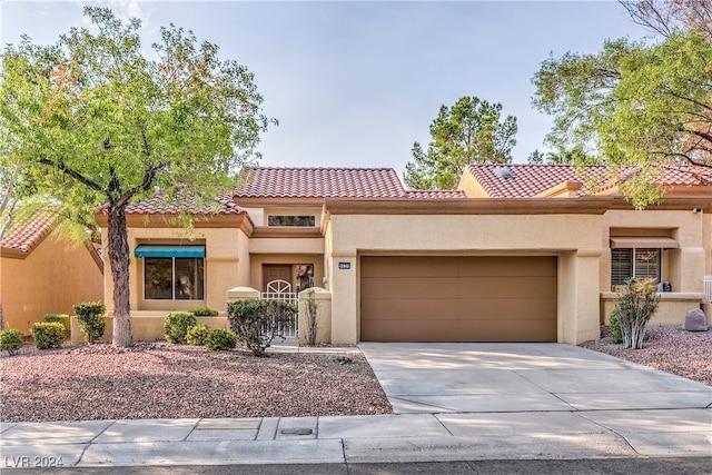 mediterranean / spanish-style house featuring a garage