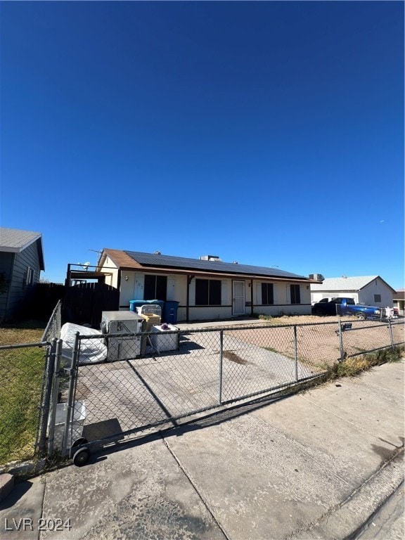 view of front of property with solar panels