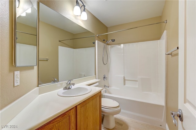 full bathroom featuring shower / tub combination, hardwood / wood-style flooring, vanity, and toilet