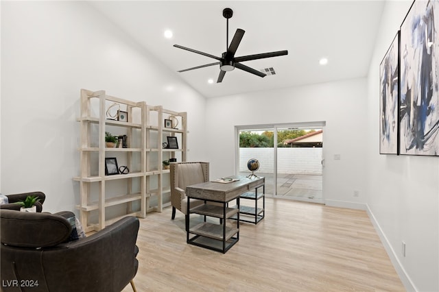 office with high vaulted ceiling, light wood-type flooring, and ceiling fan