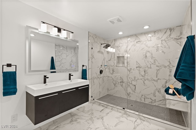 bathroom featuring vanity and a shower with shower door