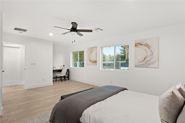 bedroom featuring light wood-type flooring and ceiling fan