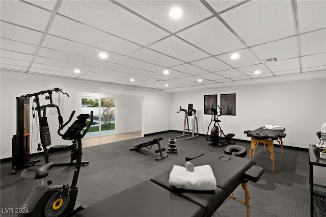 exercise room featuring a drop ceiling