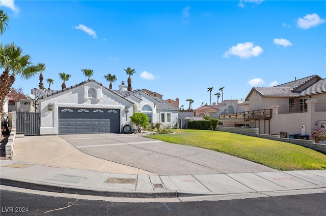 view of front facade with a garage and a front lawn