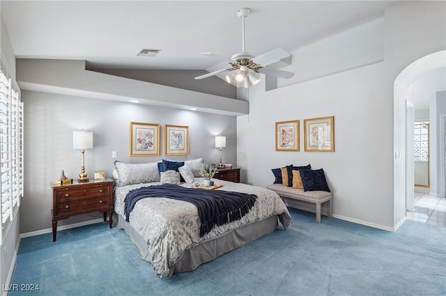 bedroom with carpet floors, lofted ceiling, and ceiling fan