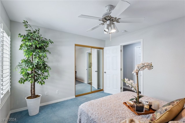 bedroom with carpet floors, ceiling fan, multiple windows, and a closet