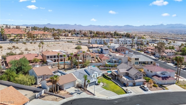 birds eye view of property with a mountain view