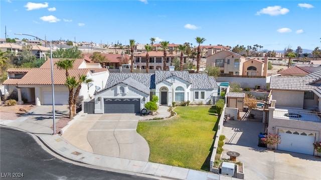 mediterranean / spanish-style house with a front yard and central AC unit