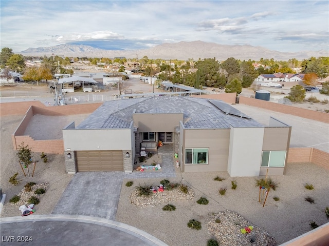 view of front of house with a mountain view and a garage