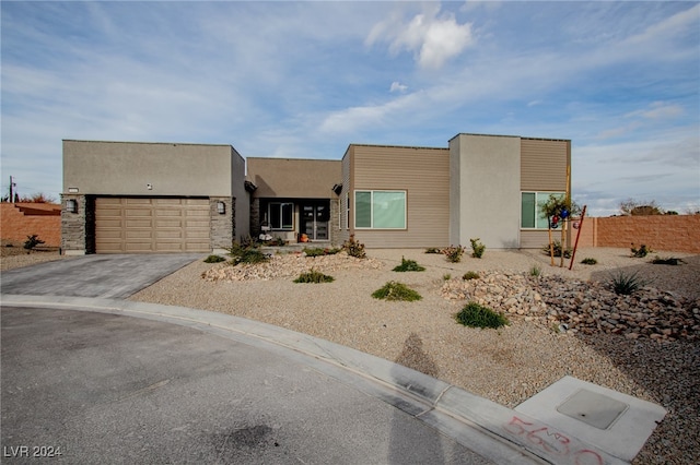 view of front of property with a garage