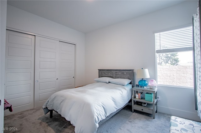 carpeted bedroom with a closet