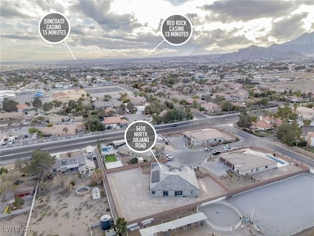 birds eye view of property featuring a mountain view