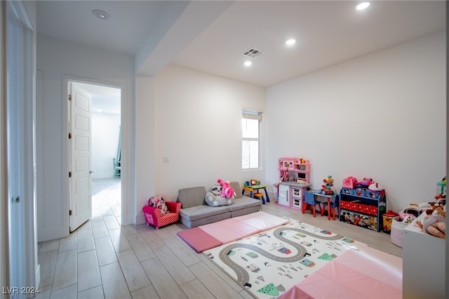 playroom featuring light wood-type flooring