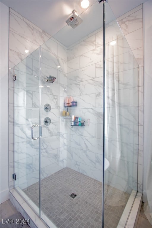 bathroom featuring an enclosed shower