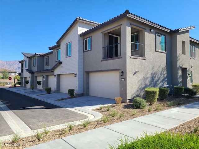 view of side of property with a garage