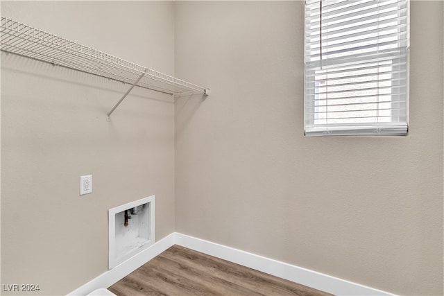 washroom featuring washer hookup and hardwood / wood-style flooring