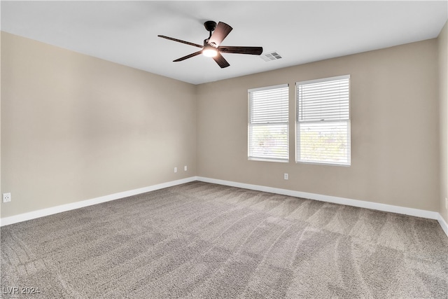 spare room with ceiling fan and carpet flooring