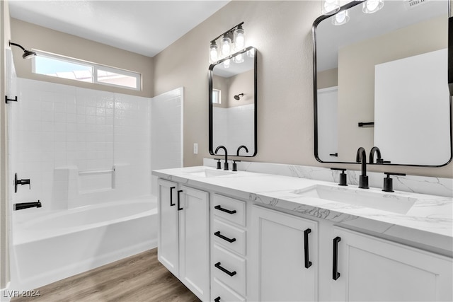 bathroom featuring shower / tub combination, vanity, and hardwood / wood-style flooring