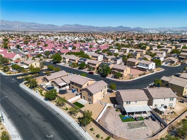 birds eye view of property with a mountain view