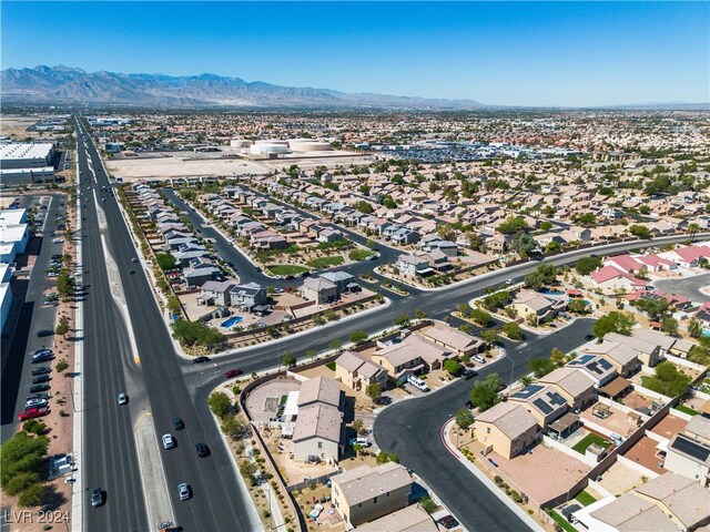 birds eye view of property with a mountain view