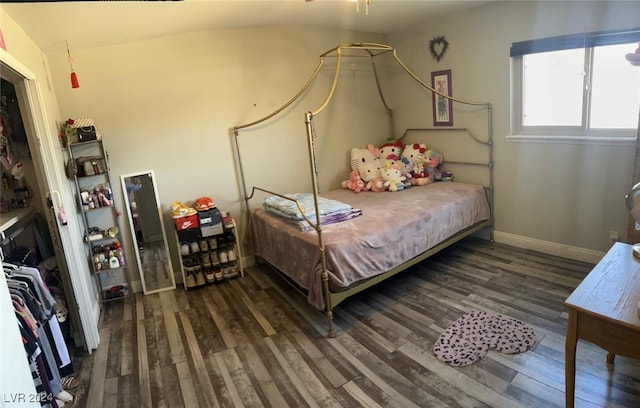 bedroom featuring a closet and dark hardwood / wood-style flooring