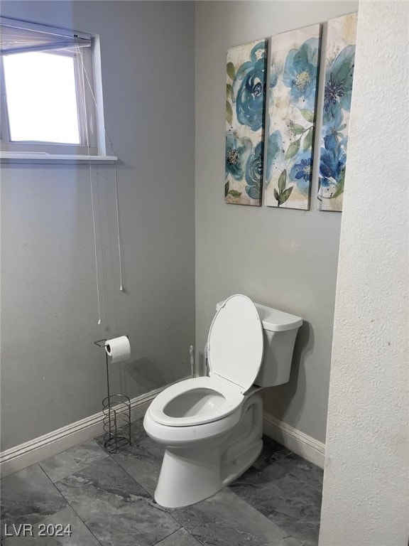 bathroom featuring toilet