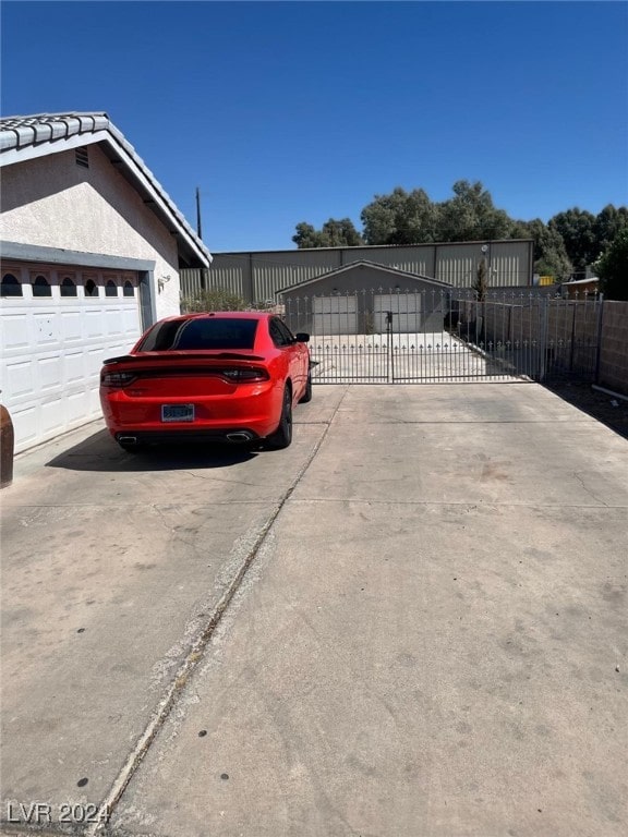 view of side of home featuring a garage