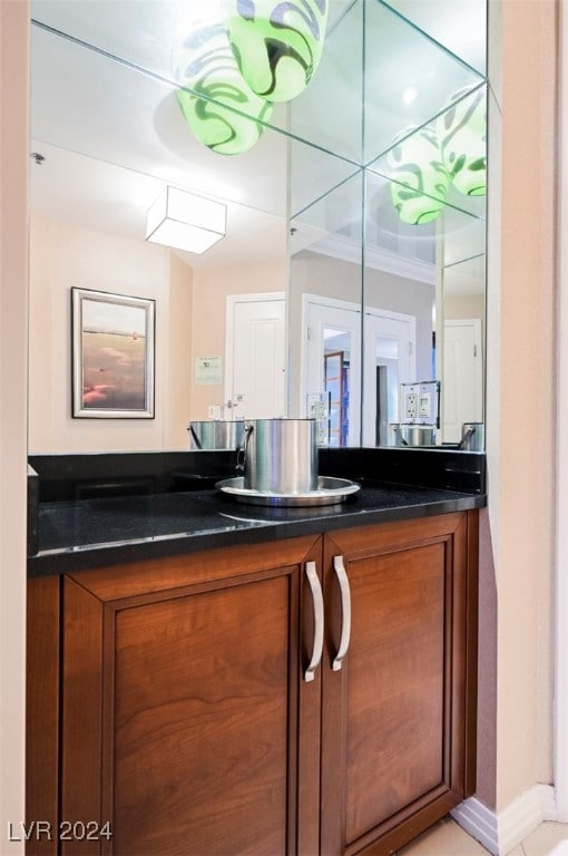 bathroom with vanity and crown molding