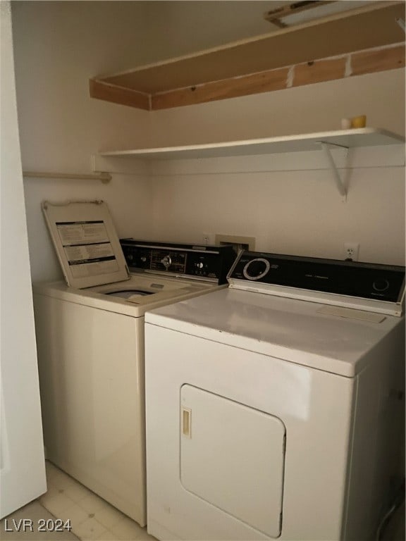 laundry room featuring washing machine and clothes dryer