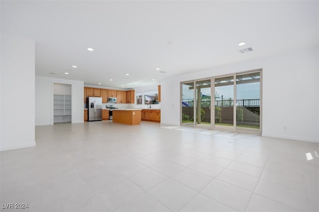 unfurnished living room with light tile patterned floors