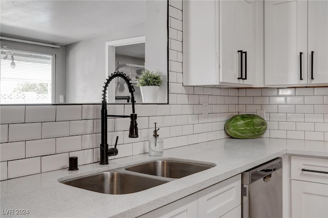 kitchen with sink and white cabinetry